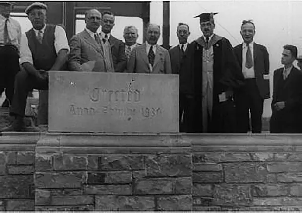 Placing the University Hall cornerstone at the 1930 commencement ceremony
