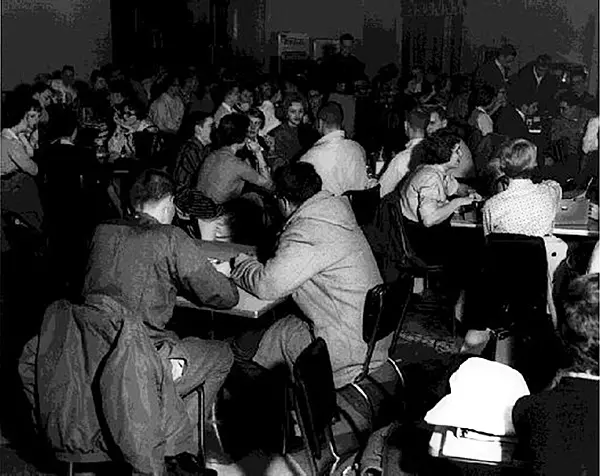 Student socialize in the donnitory cafeteria, 1961.
