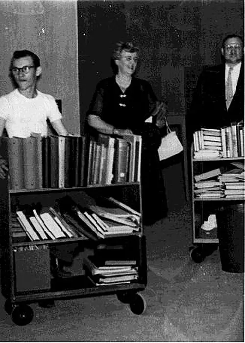 Librarian Mary Gillham leading thr library move, 1953