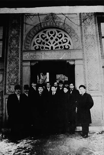 Students gathered outside the entrance to the Toledo Medical College, Cherry and Page Streets.  The college was affiliated with Toledo University in 1904