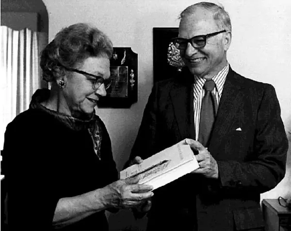 Mrs. Frank Hickerson is presented with a copy of The Tower Builder