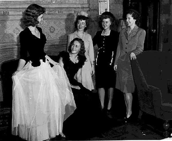 Members of Alpha Tau Sigma sorority model outfits for a style show, 1944