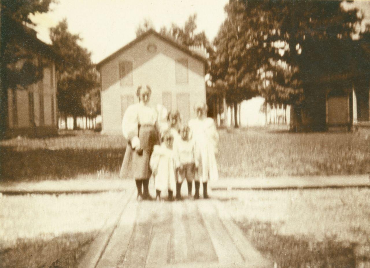 Middle Bass Club: Governor Bushnell's family.  The original club house "Club Cottage" is behind the family to the left.  The photo was taken from the Chapel.