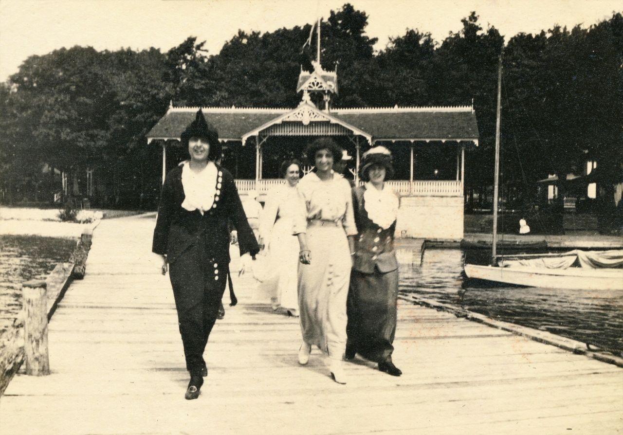 Middle Bass Club: Members walking out on the Middle Bass Club dock. Circa 1914.
