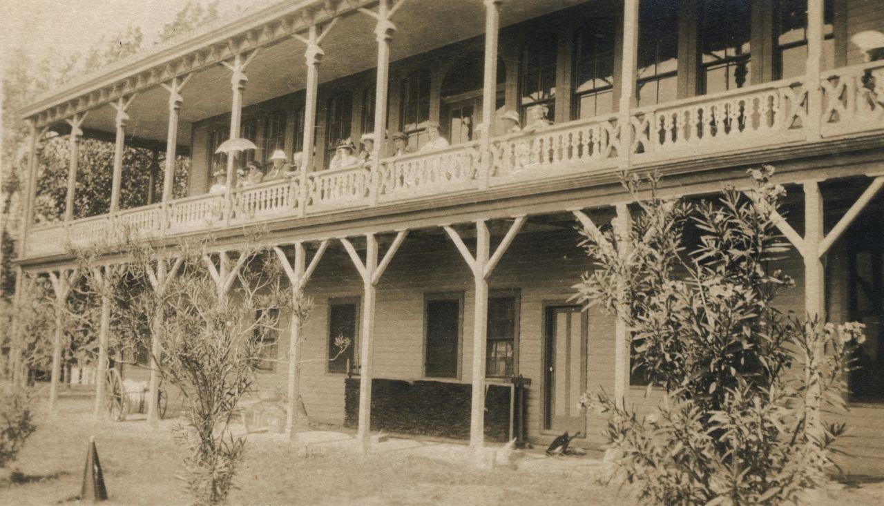 Rehberg Hall, circa 1914.  Middle Bass Club members on the balcony watching a tennis match.