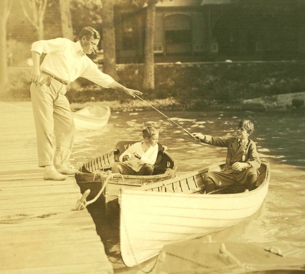 Theron B. Miller, his son Thomas E. Miller & Charlie Taft (wearing a suit) at the MBC dock
