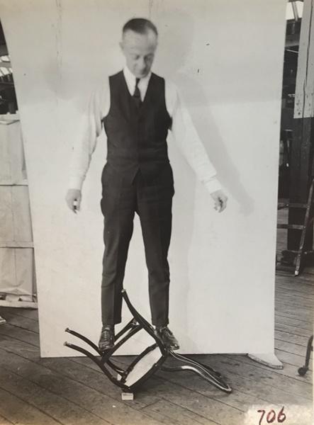 Tom Uhl testing the strength of a Uhl chair 