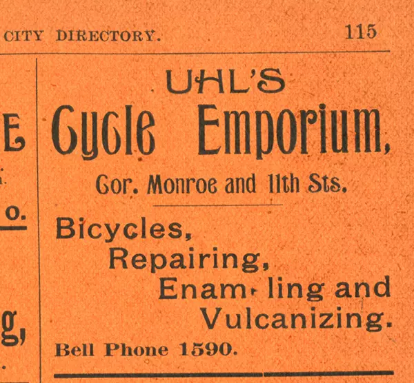 Uhl Bicycle Emporium ad in the 1897 Polk City Directory